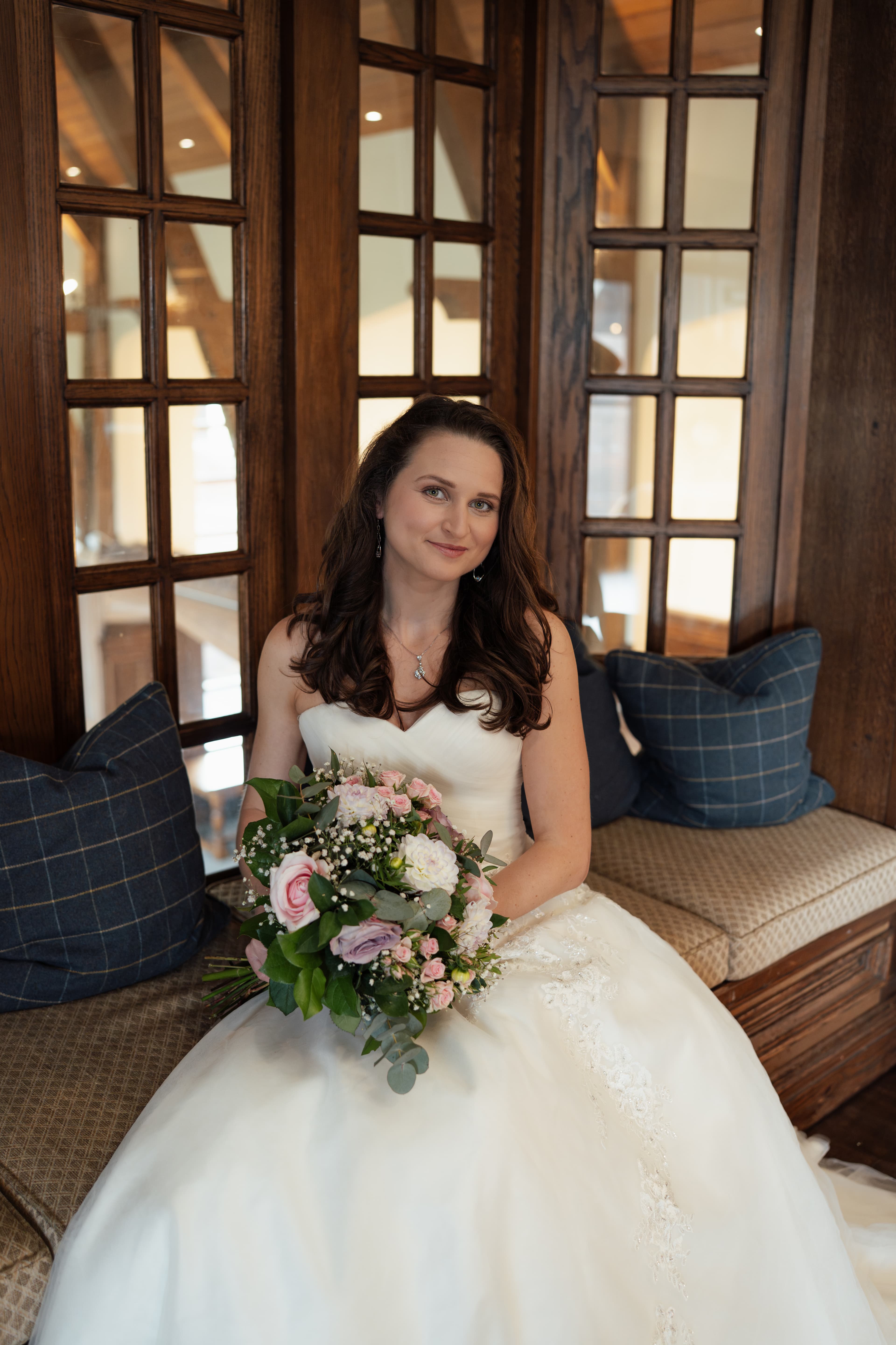 Stunning bride Claire sitting elegantly at The London Golf Club