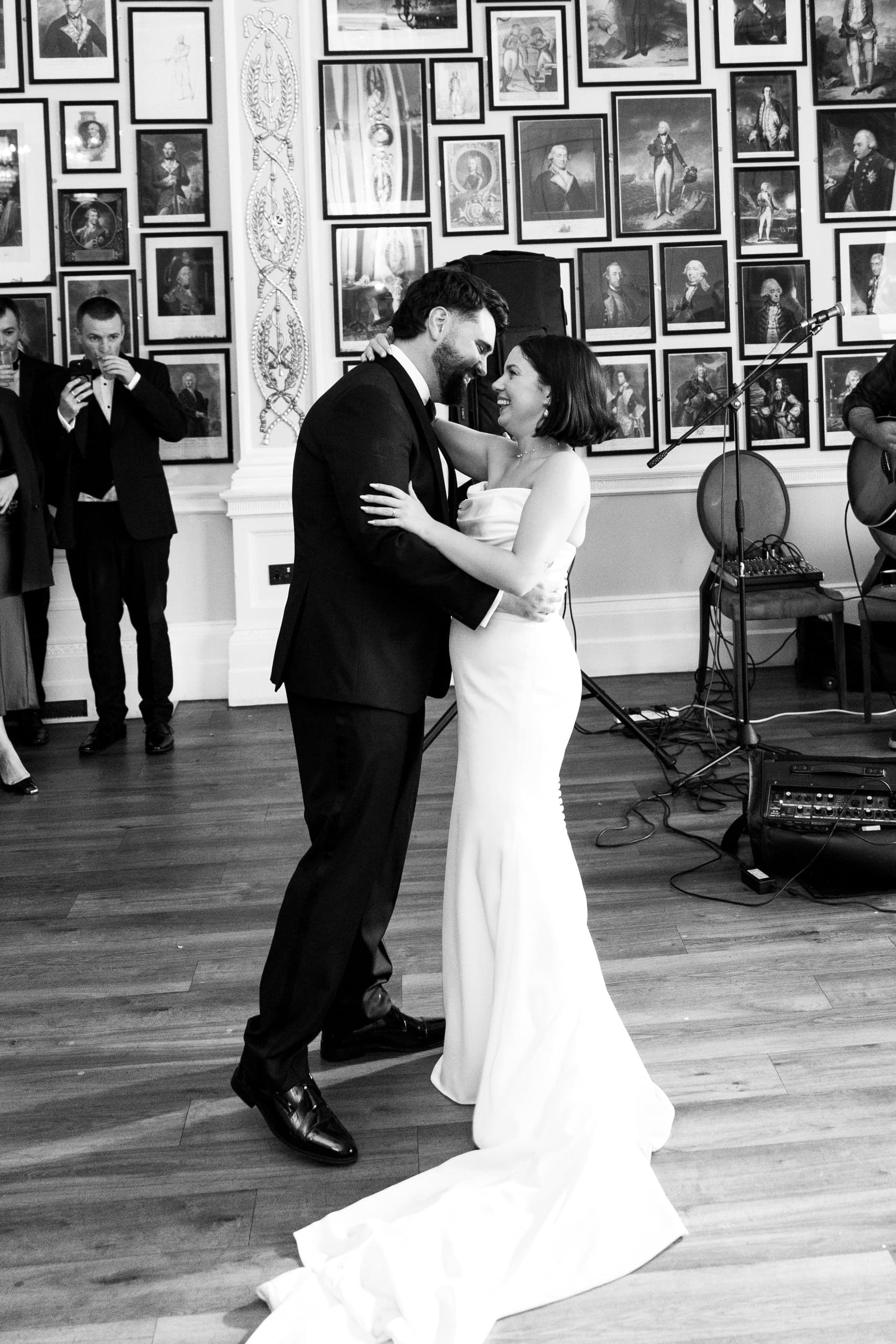 Kirsty and Jamie dancing at their Trafalgar Tavern reception, in black and white