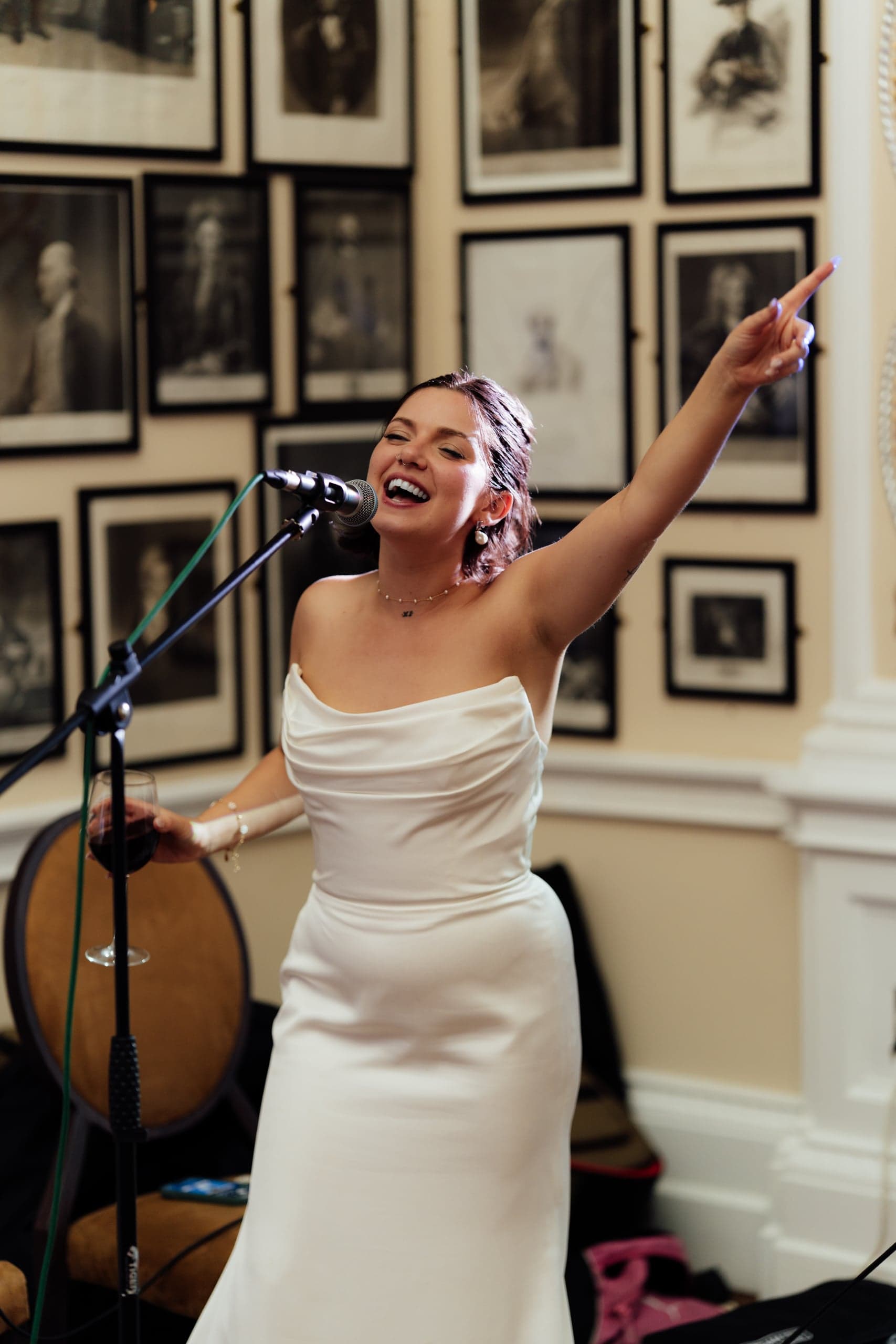 Kirsty singing along with guests during the reception at the Trafalgar Tavern