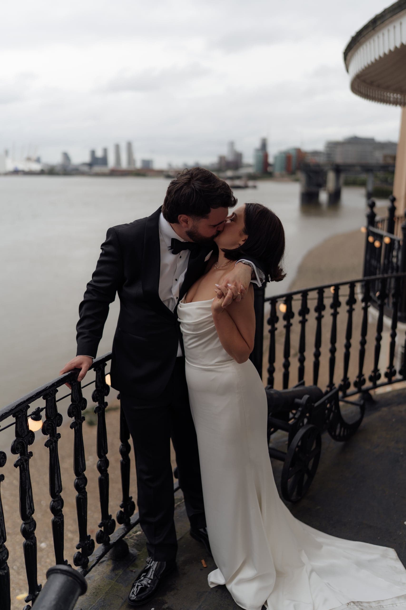 Kirsty & Jamie sharing a kiss on the famous balcony of The Trafalgar Tavern with Thames views