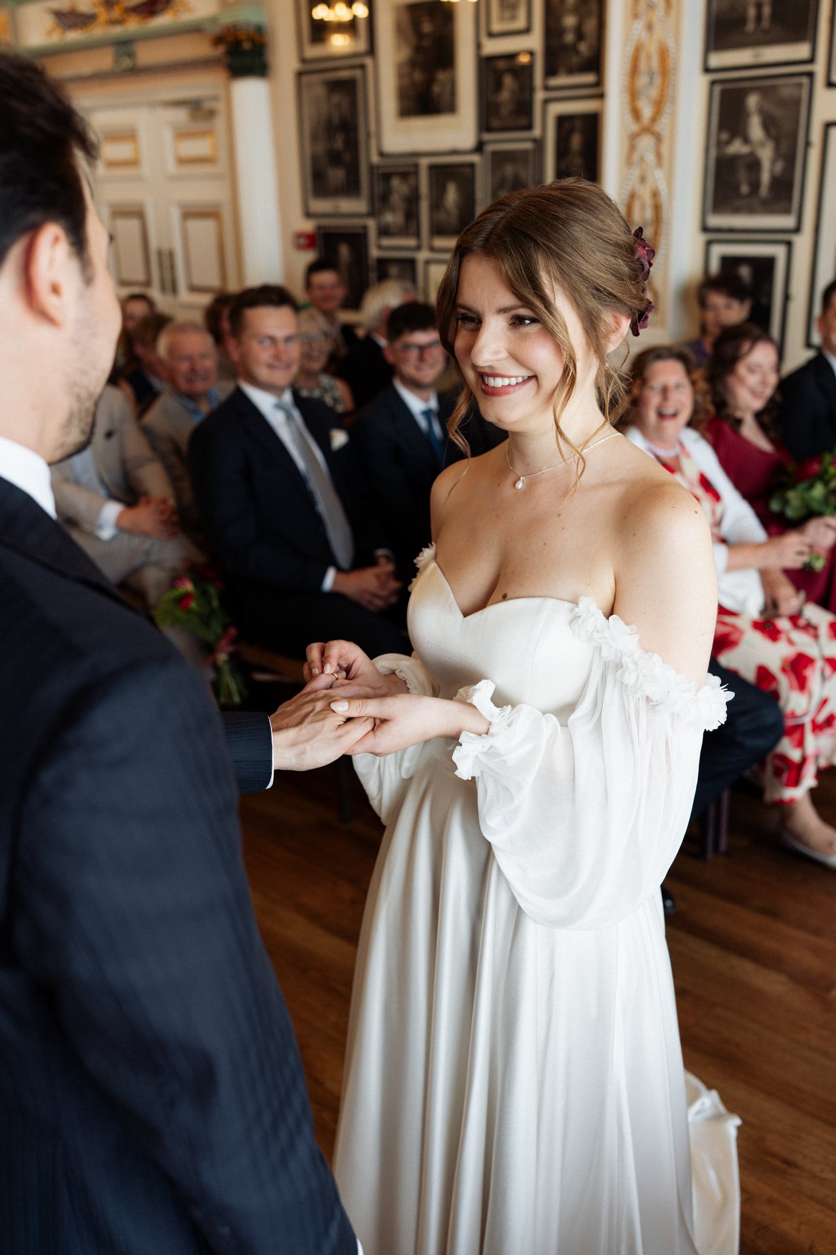 Sarah looking lovingly at new husband during wedding ceremony at Trafalgar Tavern, Greenwich London