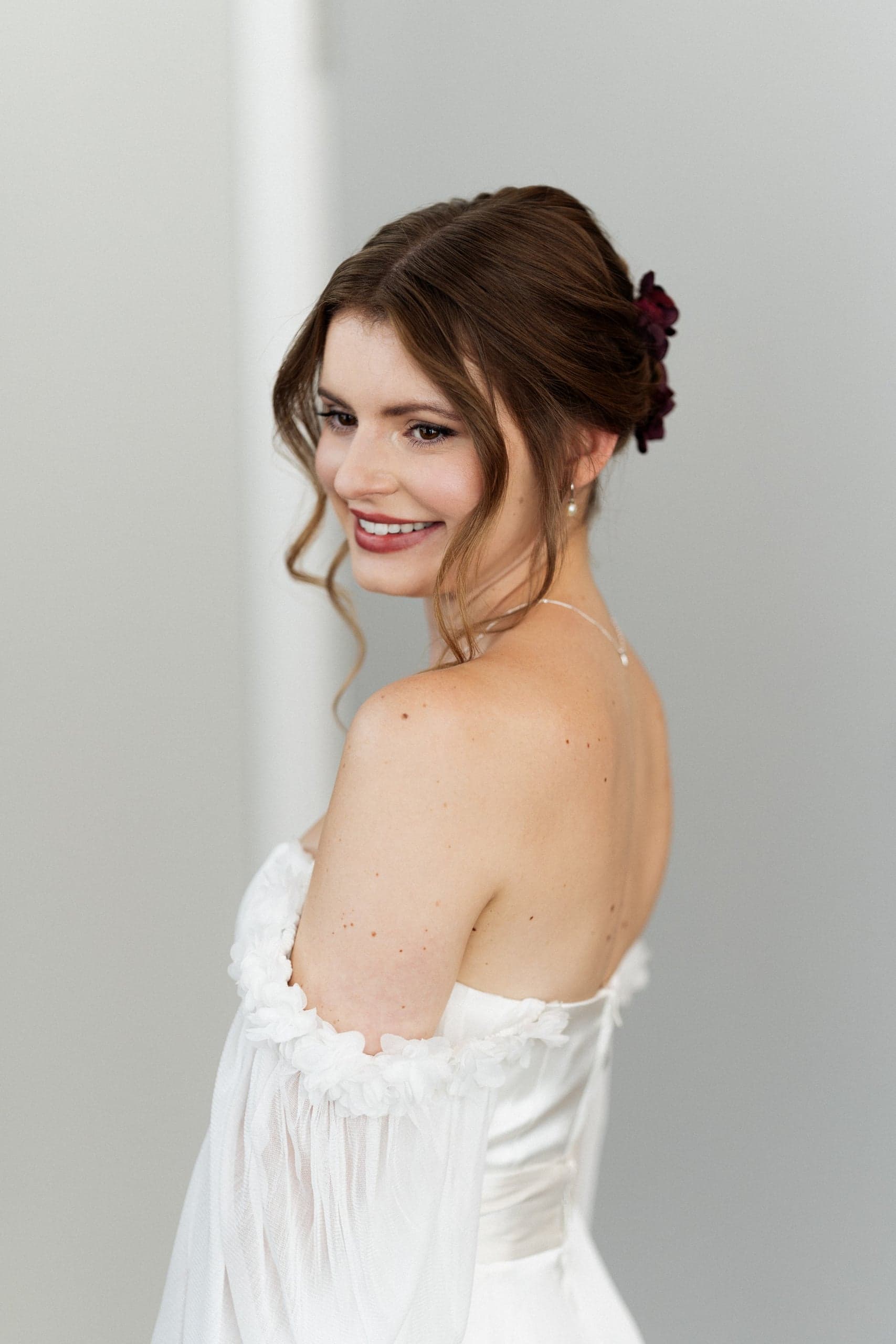 Bride in doorway before ceremony
