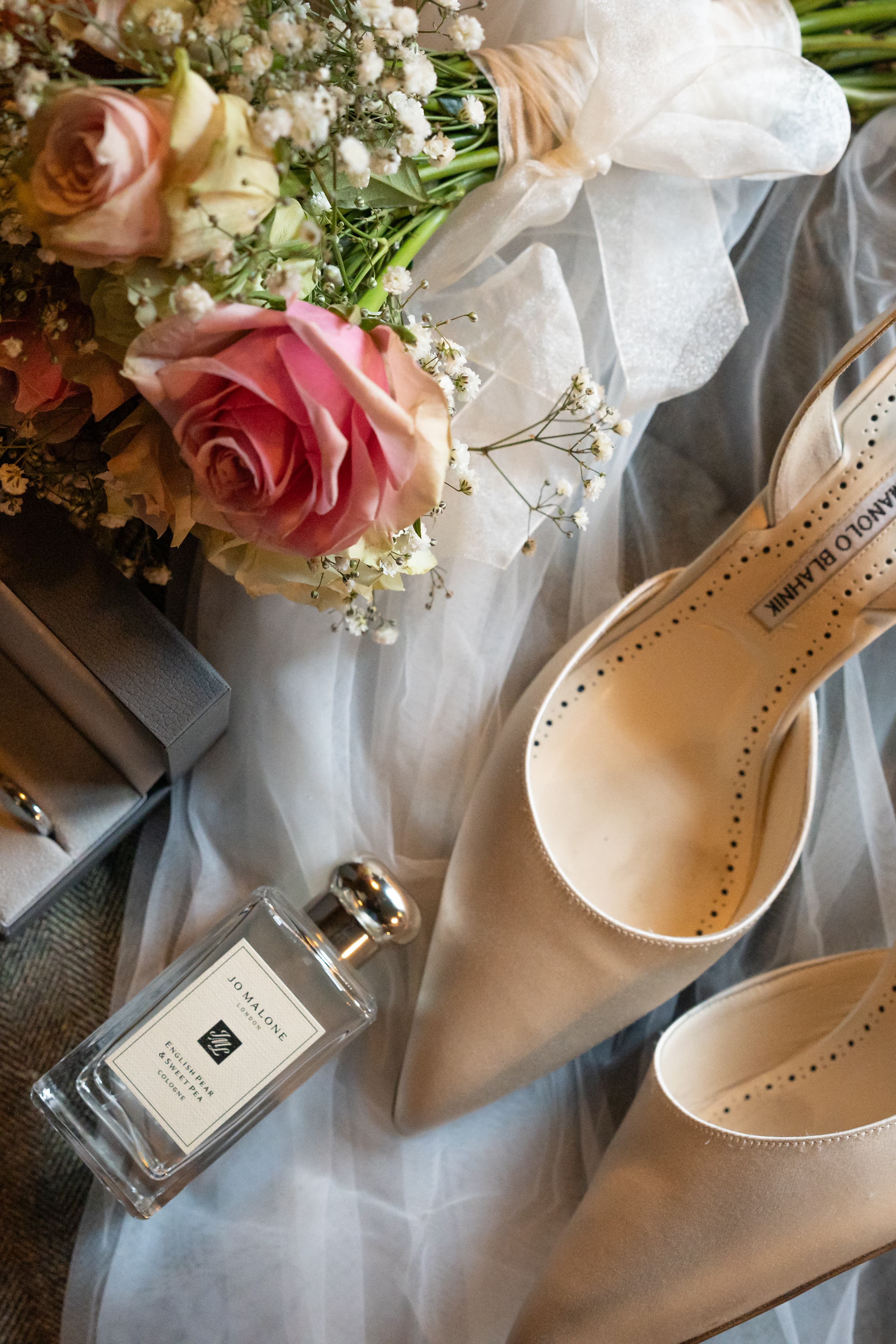 Top-down wedding still life photography featuring elegant arrangement of wedding details