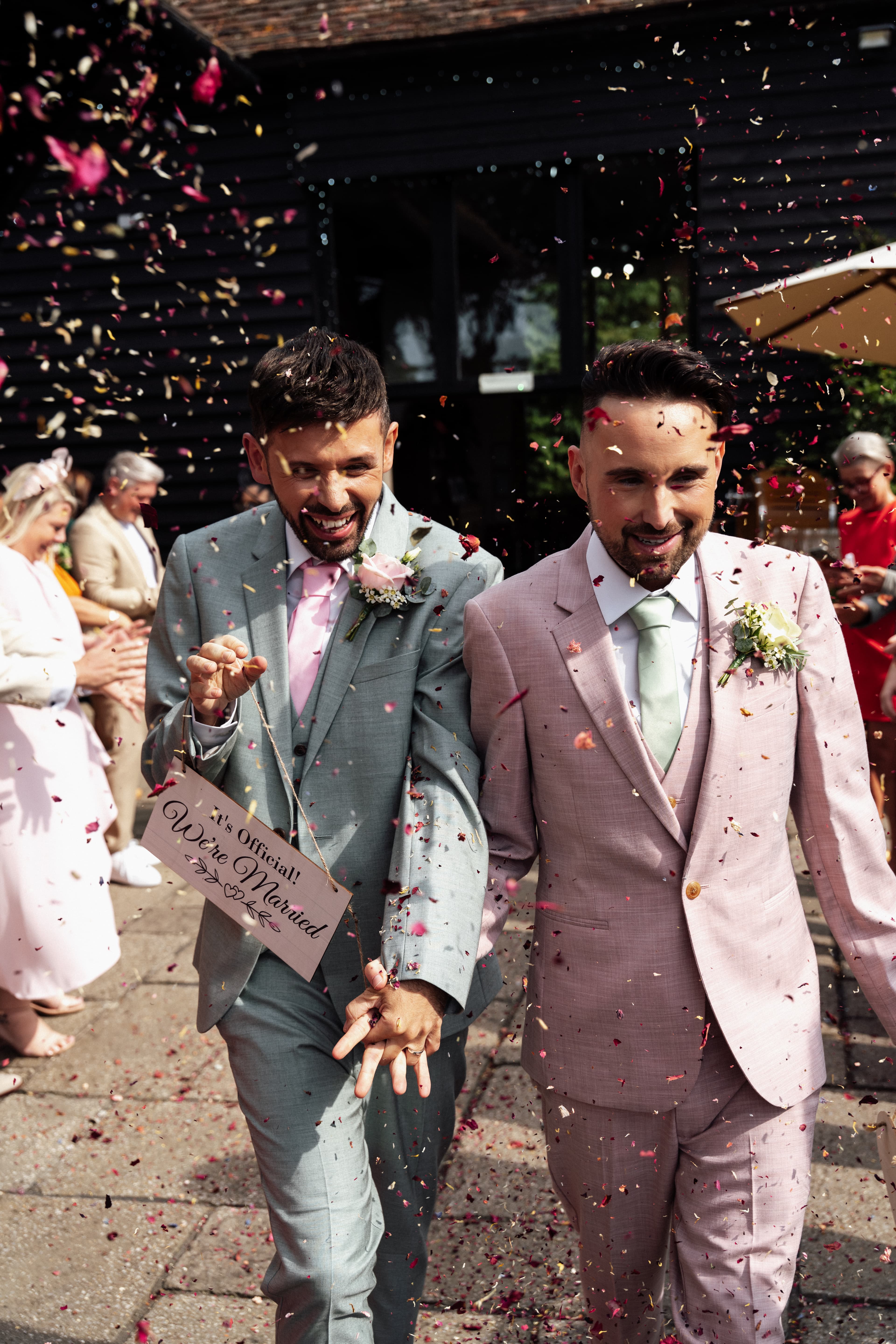 Joyful wedding moment of Ronnie and Danny with confetti celebration