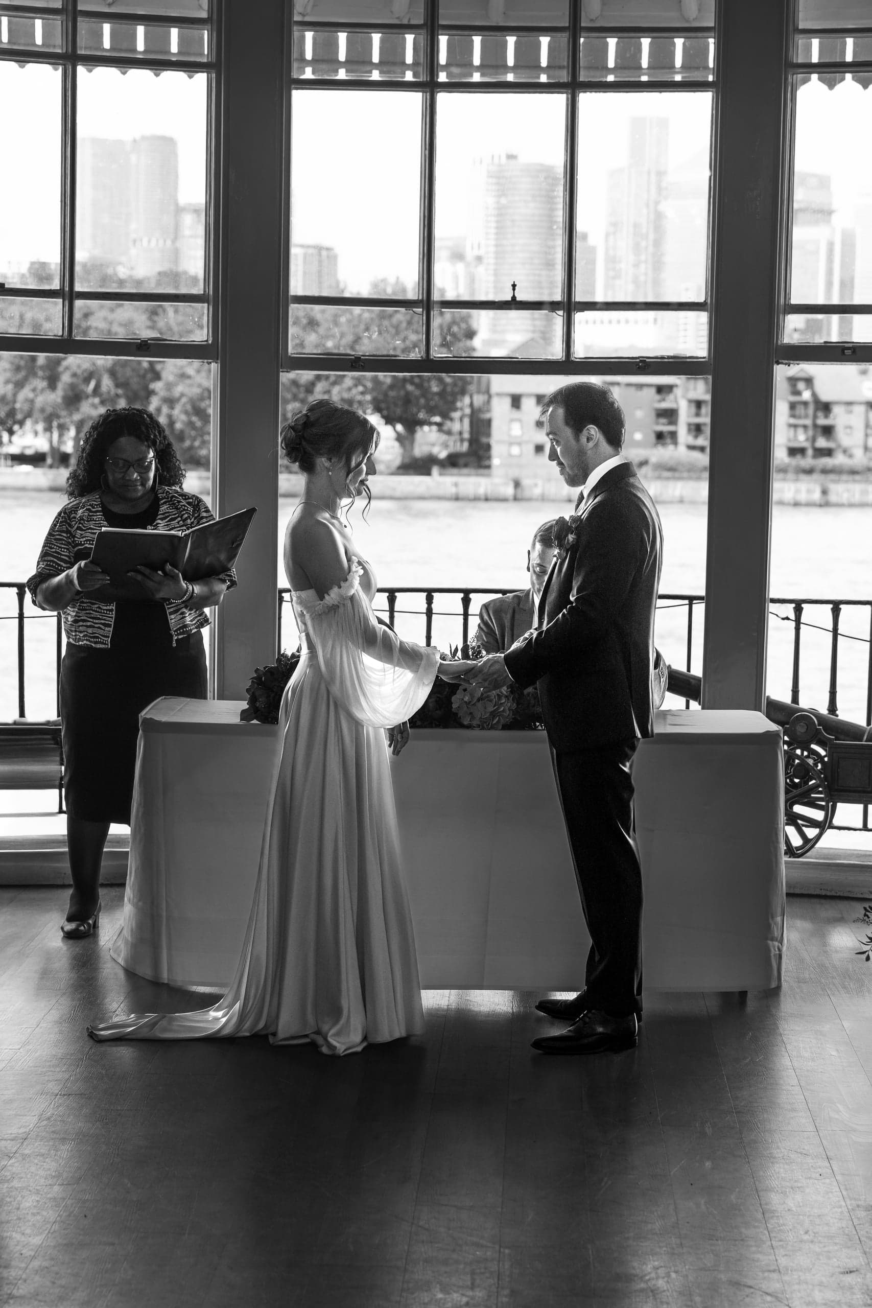 Sarah and Teddy sharing a kiss at their Trafalgar Tavern wedding in Greenwich